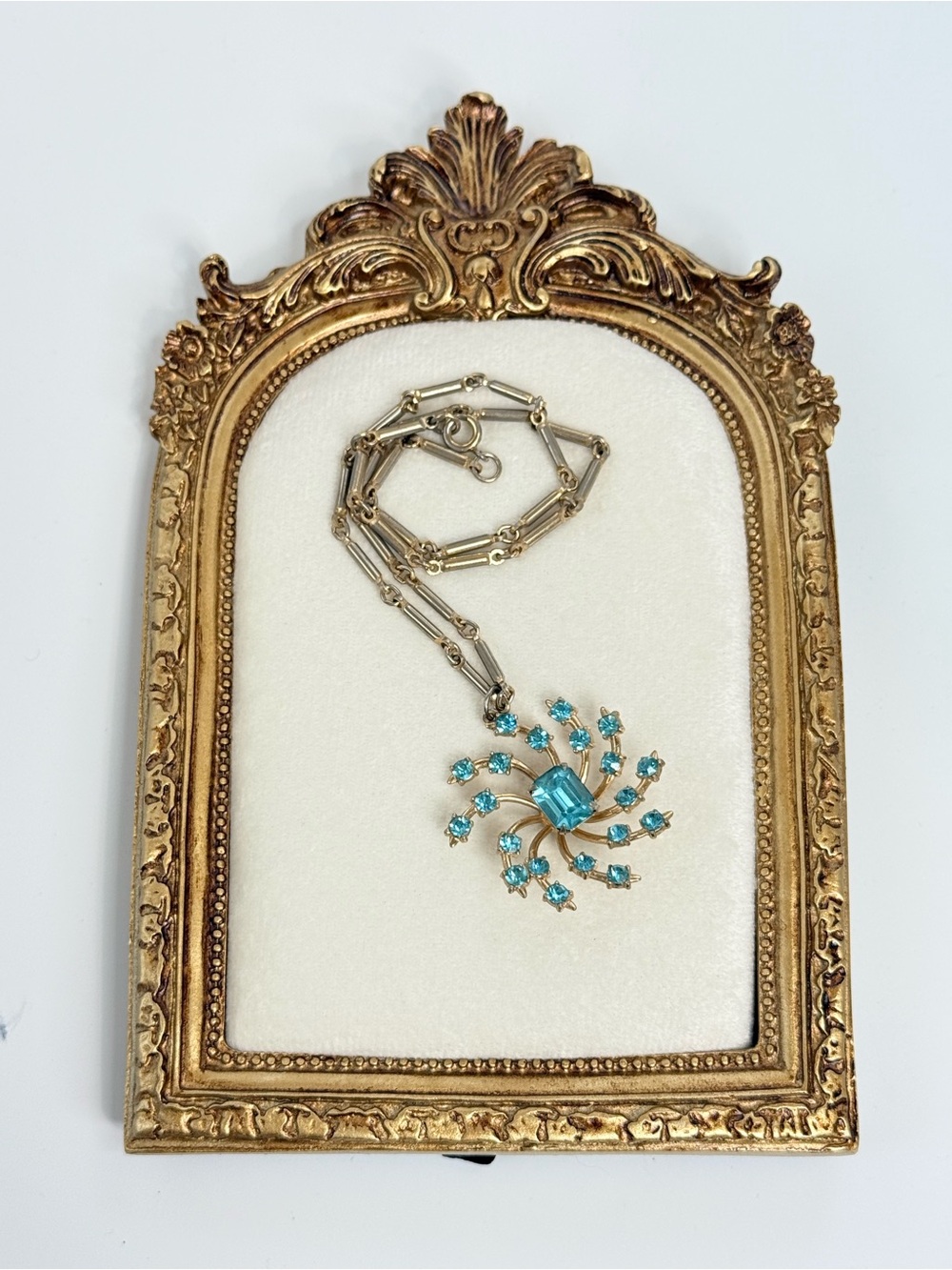 Coro vintage  1950s Pegasus necklace gold tone pinwheel pendant